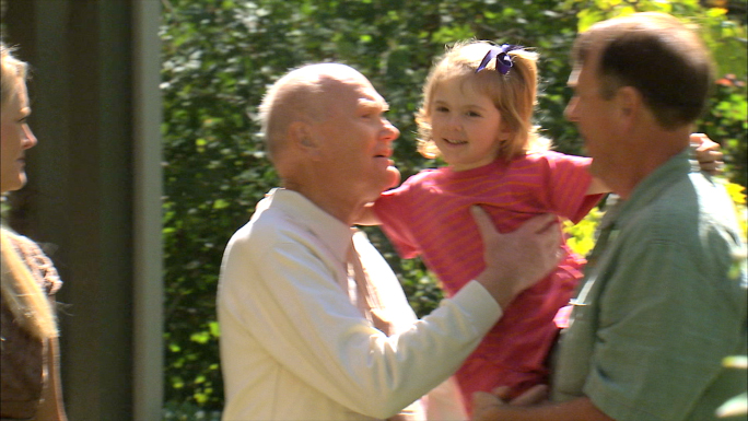 Grandpa Gives a Hug Goodbye to His Granddaughter Stock Photo Grandpa Gives a Hug Goodbye to His Granddaughter Stock Photo