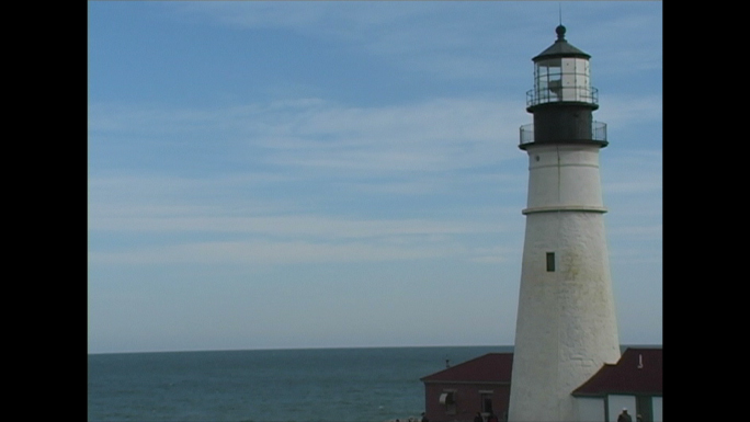 White Lighthouse and Ocean Horizon